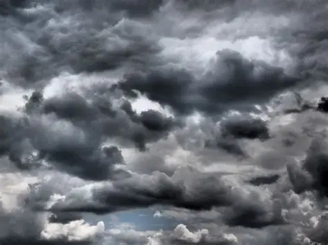 Danger is gathering like a dark storm Picture of black ominous clouds
